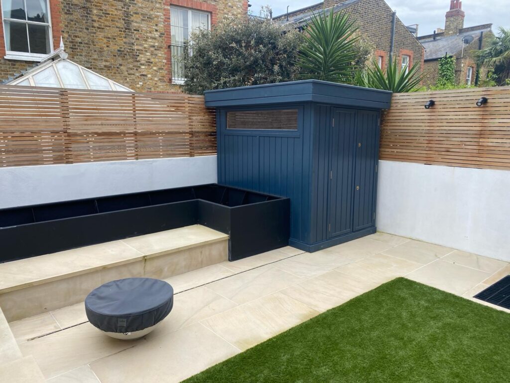 Quarrendon Street Fulham London SW6- New garden design including shed-trellis-stone work-bespoke planters and walking on sky light