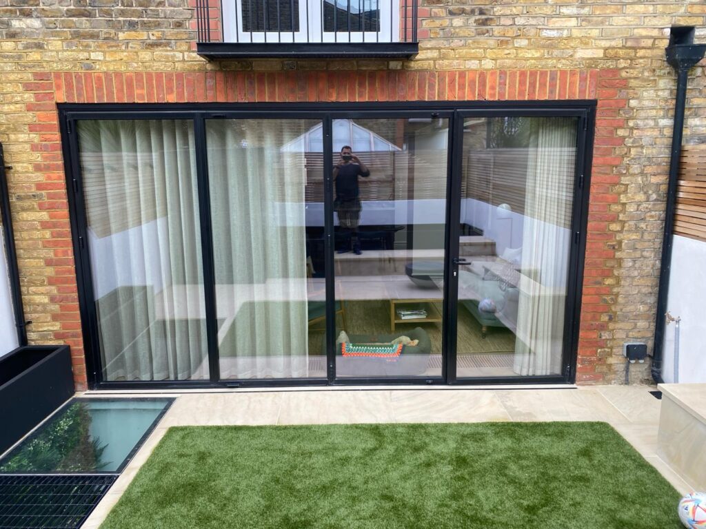 Quarrendon Street Fulham London SW6- New garden design including shed-trellis-stone work-bespoke planters and walking on sky light