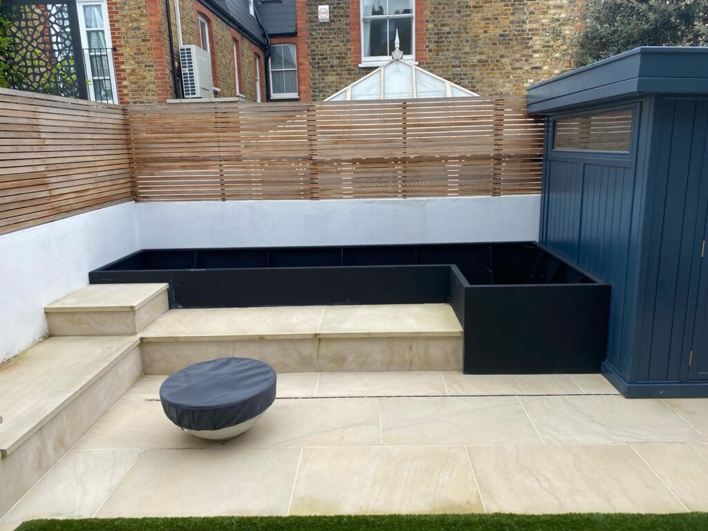 Quarrendon Street Fulham London SW6- New garden design including shed-trellis-stone work-bespoke planters and walking on sky light