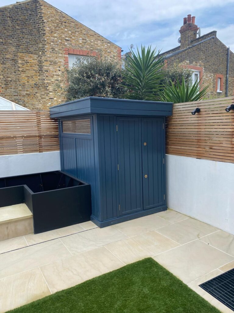 Quarrendon Street Fulham London SW6- New garden design including shed-trellis-stone work-bespoke planters and walking on sky light