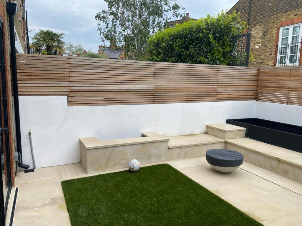 Quarrendon Street Fulham London SW6- New garden design including shed-trellis-stone work-bespoke planters and walking on sky light