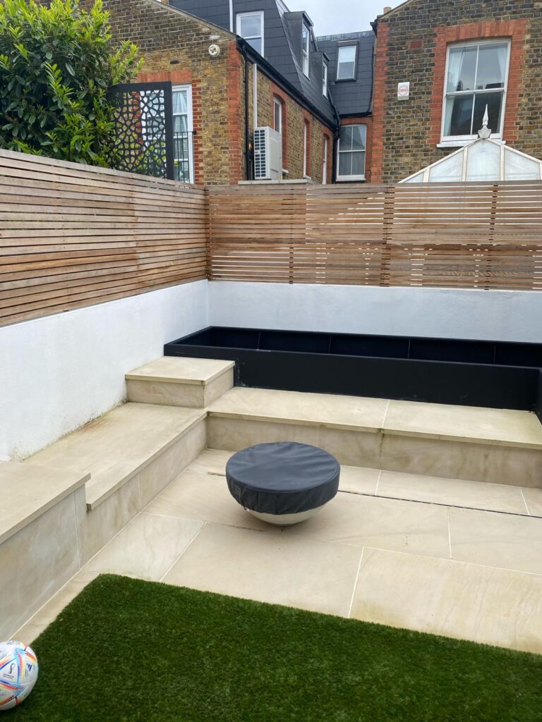 Quarrendon Street Fulham London SW6- New garden design including shed-trellis-stone work-bespoke planters and walking on sky light